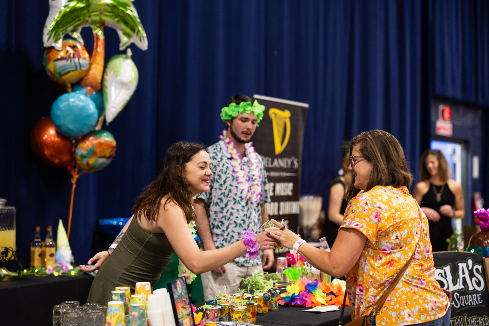 Contestant serving cocktail.